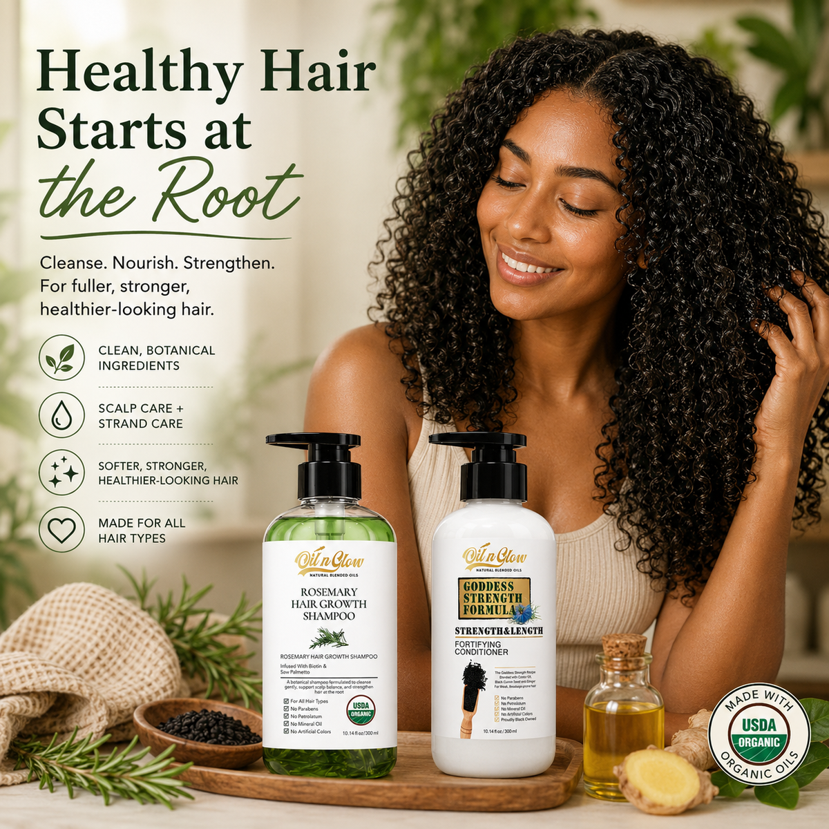 Woman touching her long dark curls behind OilnGlow rosemary shampoo and cumin conditioner on a wooden tray with botanical ingredients.